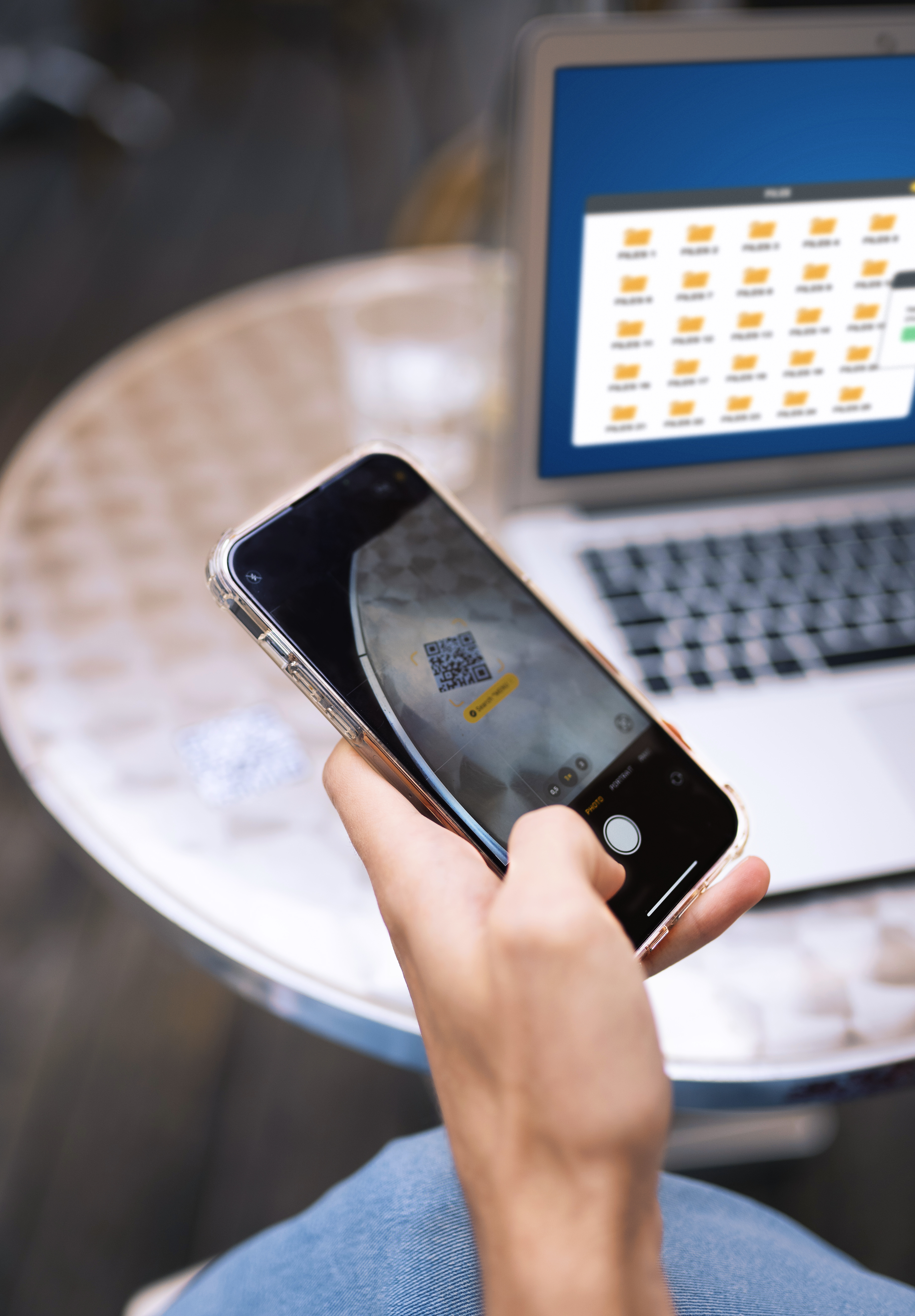 Friends waving while using their phones